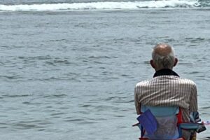 Man sitting on Maui beach